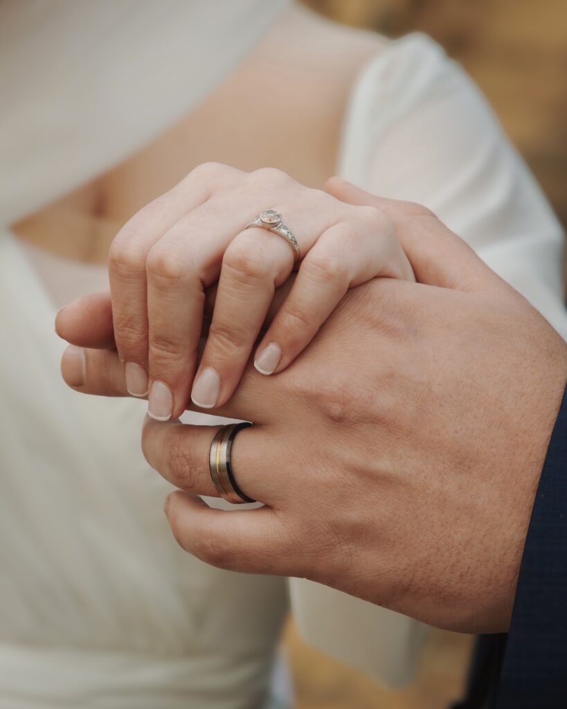 Hands showing off wedding rings